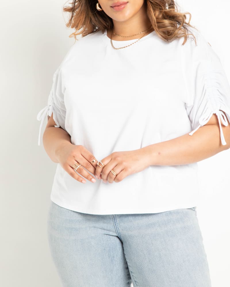 Front of a model wearing a size 22|24 Shirred Sleeve Tee in True White by ELOQUII. | dia_product_style_image_id:303837